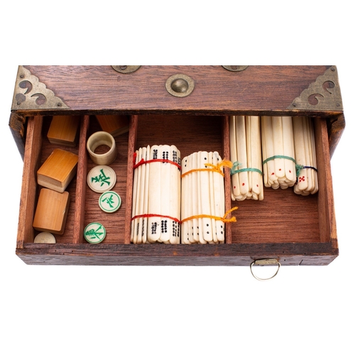 341 - An early 20th century Mah Jong set with five drawers fully fitted with bone and bamboo tiles and gam... 