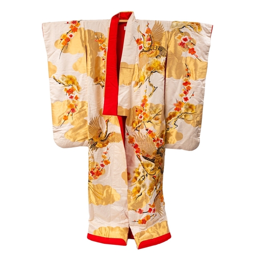 351A - A Japanese Kimono embroidered in silk and gilt thread with cranes amongst blossom and pine, red silk... 