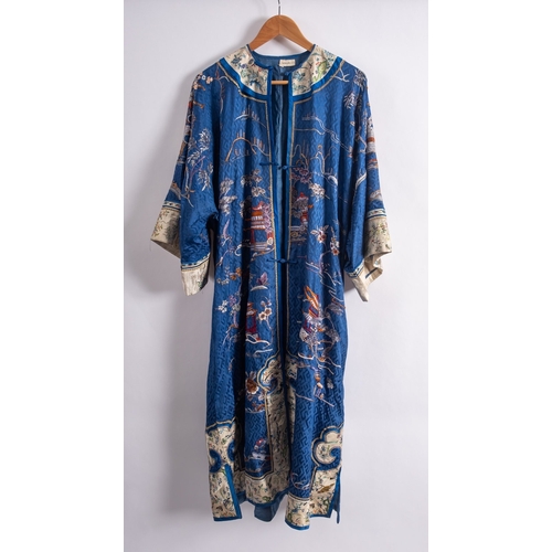 356A - A Chinese silk blue-ground robe and a pair of slippers embroidered overall with pavilions, birds, fl... 