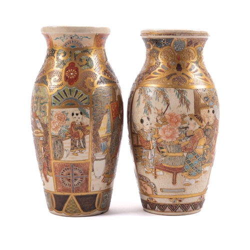 38 - A pair of Japanese Satsuma vases, of shouldered oviform decorated with panels of figures in landscap... 