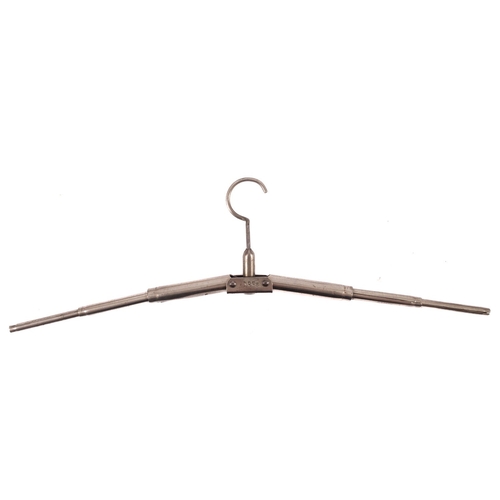 387 - A travelling telescopic pocket coat hanger, initialled D.R.P, a horn handled steel ham bone holder, ... 