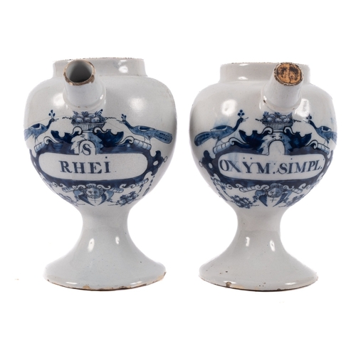 47 - A pair of Dutch delftware blue and white wet drug jars the 'peacock' labels inscribed 'S Rhei' and '... 