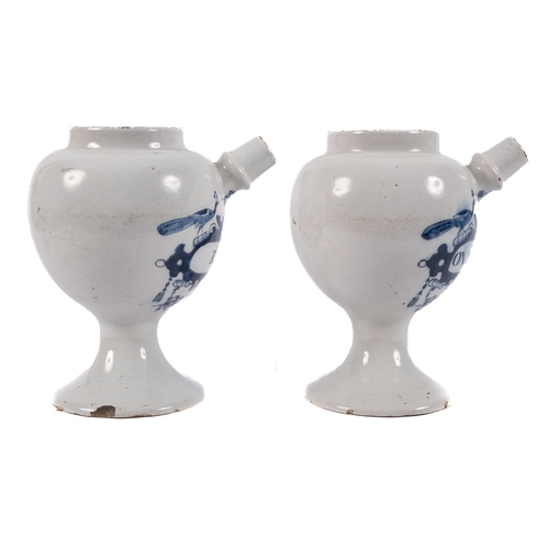 47 - A pair of Dutch delftware blue and white wet drug jars the 'peacock' labels inscribed 'S Rhei' and '... 