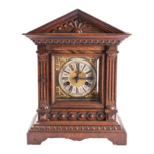 485 - Junghans, Germany, an oak Westminster chiming mantel clock having an eight-day duration movement chi... 