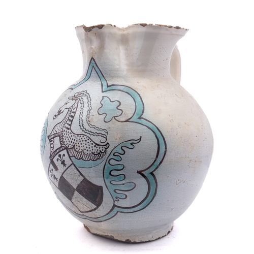 54 - A massive Umbrian maiolica armorial jug, probably Orvieto, of globular form with pinched spout, pain... 