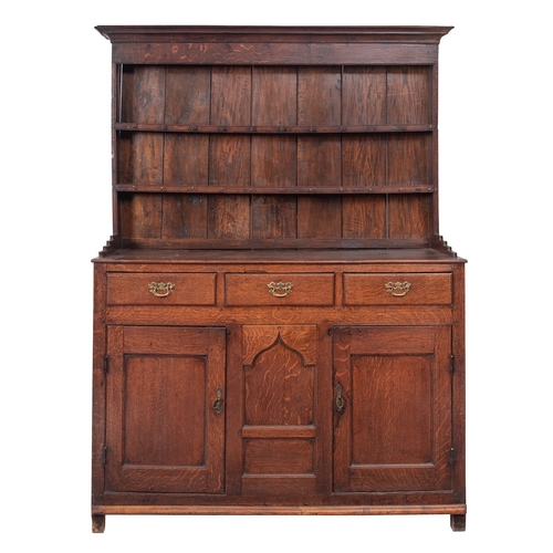 752 - A George III oak dresser, late 18th century and later; the associated plate rack with moulded cornic... 