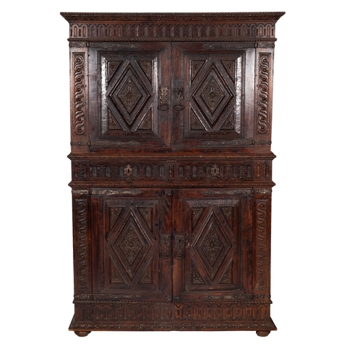 758 - A Dutch carved oak Hallenschrank, in 17th century style, 19th century; the ropetwist and stylised fo... 