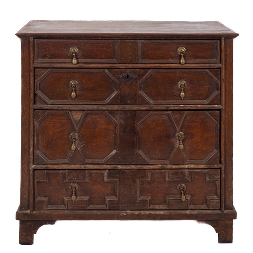 768 - A 17th Century oak rectangular chest, containing four long geometrically moulded panel drawers, on l... 