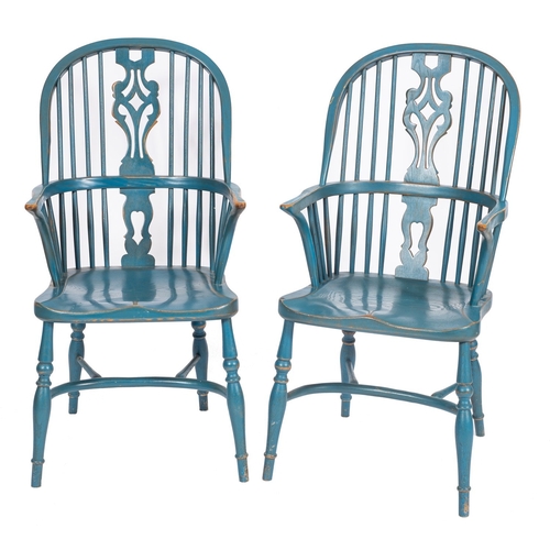 771 - A pair of teal painted wood Windsor elbow chairs in George III style, 20th century; the arched backs... 