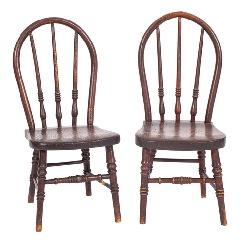 772 - A near matching pair of 19th Century elm and beech stick back Windsor child's chairs, the hoop backs... 