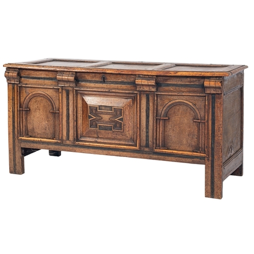 773 - A late 17th/early 18th Century oak rectangular coffer, with a plain triple panel hinged top, the fro... 