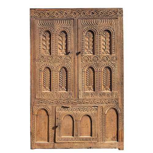 783 - A Jacobean carved oak linen cupboard, basically 17th century with adaptions; the relief carved friez... 