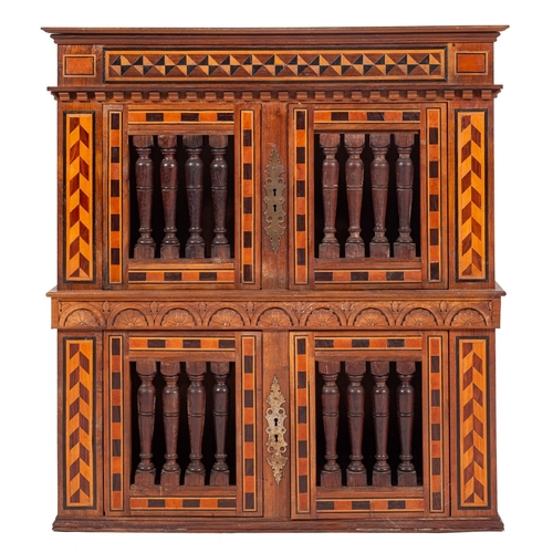 784 - A George V walnut and parquetry cupboard in 17th century taste, dated 1928; with moulded cornice abo... 