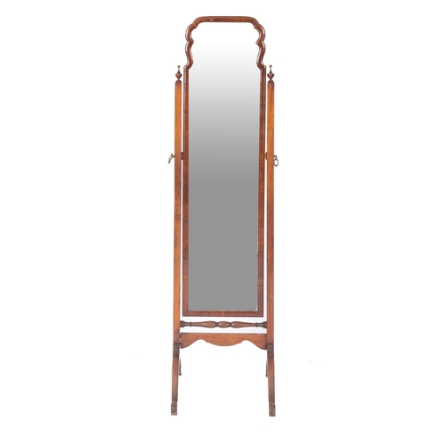 797 - A walnut cheval mirror in Queen Anne taste, early 20th century; the rectangular angle adjustable pla... 