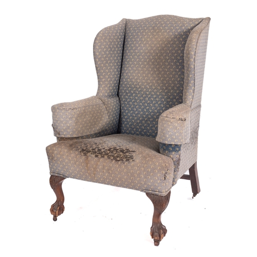 800 - A mahogany and stained beech wing frame armchair in the George II taste, fully upholstered, on cabri... 