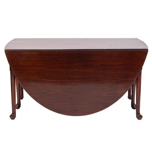 802 - A George II mahogany gateleg dining table, circa 1740; the oval top with moulded edge and twin drop ... 