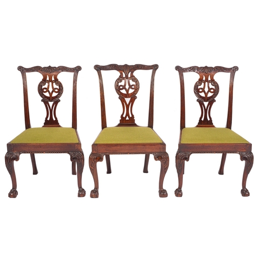 803 - A set of seven late George II mahogany dining chairs, mid 18th century; the backrests with foliate c... 