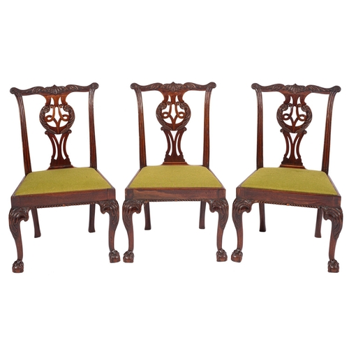 803 - A set of seven late George II mahogany dining chairs, mid 18th century; the backrests with foliate c... 