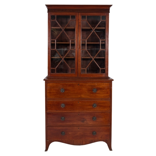 831 - A George III mahogany secretaire bookcase, circa 1810, with moulded cornice and reeded frieze, above... 