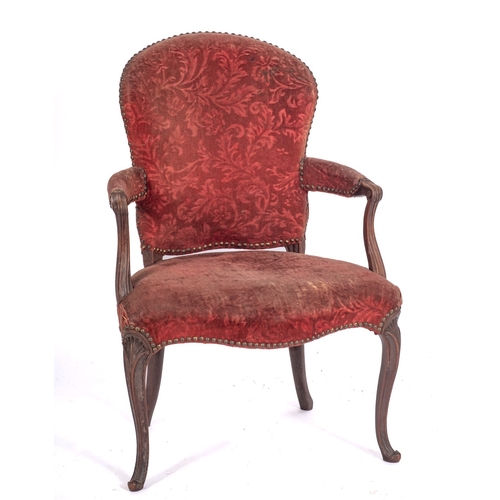 837 - A George III mahogany open armchair in the French Hepplewhite manner, with an upholstered stuff over... 