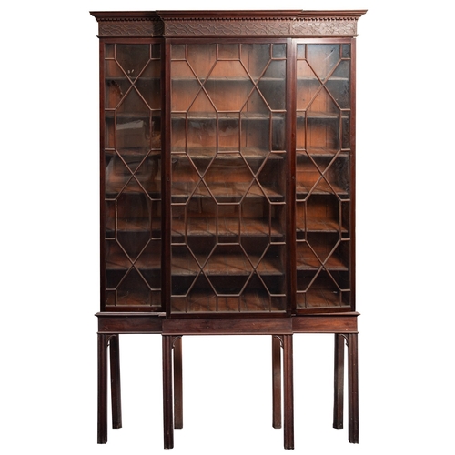 839 - A George III mahogany and glazed breakfront bookcase on stand, late 18th century; with moulded and d... 