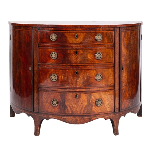 842 - A George III mahogany demi-lune side cabinet. late 18th century; the crossbanded top above four grad... 