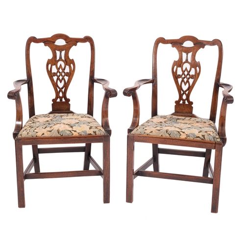 844 - A pair of George III mahogany library elbow chairs, late 18th century; the rectangular backrests wit... 