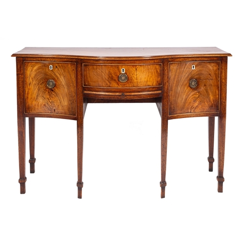 845 - A late George III mahogany serpentine front sideboard, early 19th century; the top with moulded edge... 