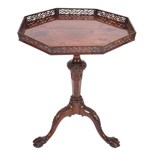 847 - A carved mahogany occasional table in George III style, 19th century; the octagonal flip top with op... 