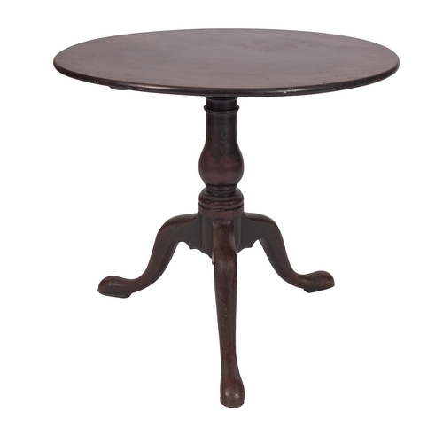 856 - A George II mahogany circular occasional table, mid 18th century; the single piece top and block on ... 