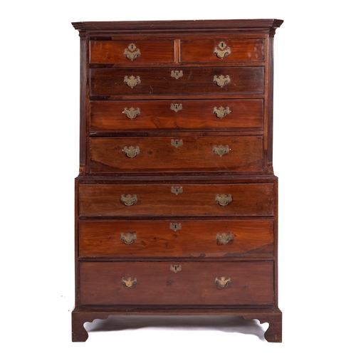 859 - A George III mahogany chest on chest, the upper part with a moulded cornice and cut corners, contain... 