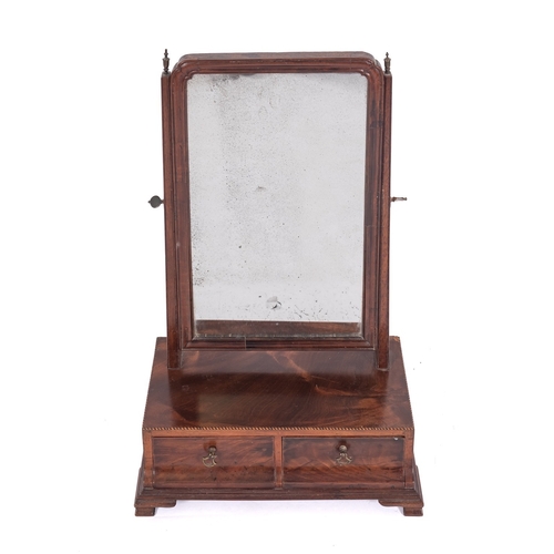 861 - A George III mahogany and inlaid swing frame platform toilet mirror, the rectangular plate in cushio... 