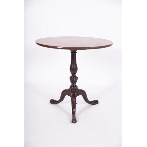 867 - A George III mahogany circular tea table, the snap top on a turned baluster and spirally fluted vase... 