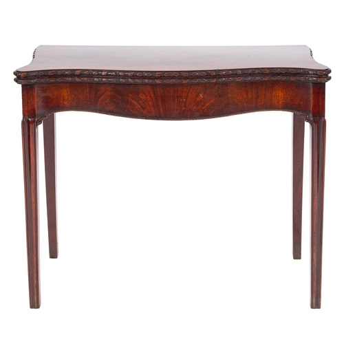 874 - A George III mahogany serpentine front card table, early 19th century; the hinged top with foliate a... 