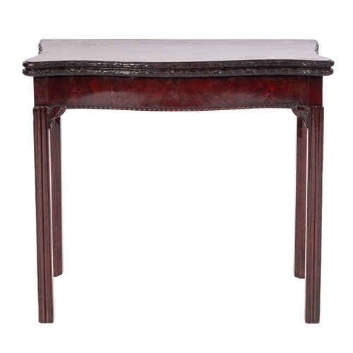 875 - A George III mahogany serpentine front card table, late 18th /early 19th century; the hinged top wit... 