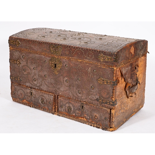 877 - A Continental studded leather covered softwood coffer, first half 18th century; the domed top with s... 