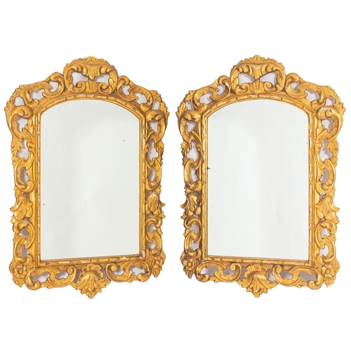 883 - A pair of carved and giltwood framed wall mirrors in 18th Century taste, probably Spanish, 20th cent... 