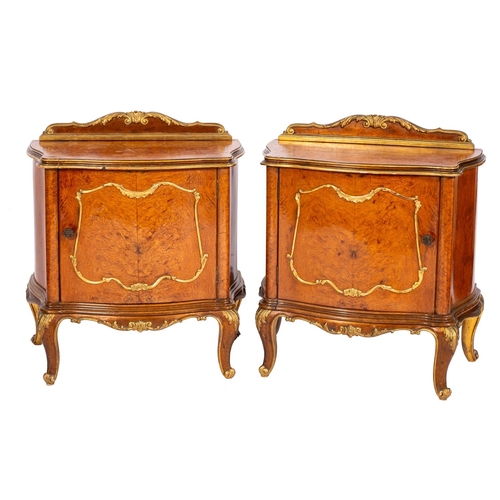 884 - A burr walnut and parcel gilt double bed in Louis XV transitional style, 20th century; the serpentin... 