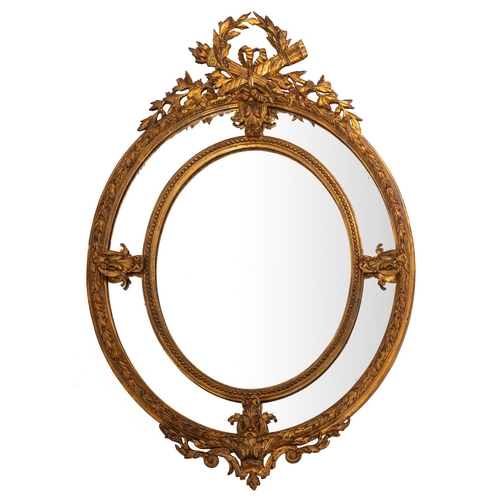 890 - A giltwood and composition framed oval marginal wall mirror in Louis XV taste, 20th century; the ope... 