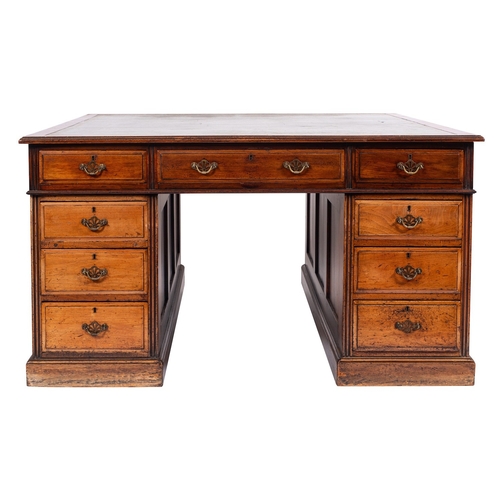 897 - A mahogany partners desk in Regency style, early 20th century; the top with inset gilt tooled green ... 