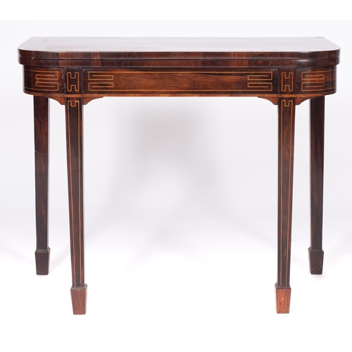 898 - A Regency rosewood card table, circa 1815, the D-shaped folding top upon a box-strung frieze on squa... 