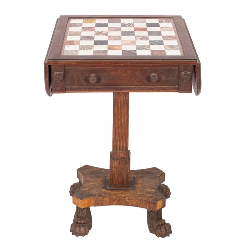 908 - A Regency oak and marble drop flap games table, the hinged top with inset white and coloured marble ... 