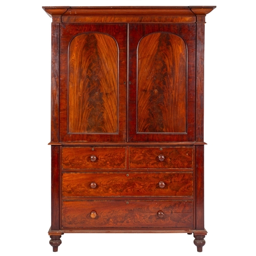 915 - A Regency mahogany linen press, early 19th century; with inverted breakfront and moulded cornice abo... 