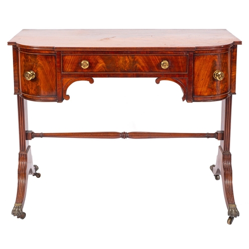 926 - A George IV mahogany bowfront dressing table, circa 1825; the top with reeded edges, above an arrang... 