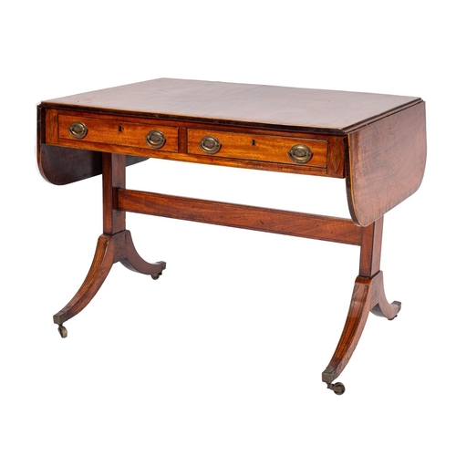 939 - A Regency mahogany sofa table, early 19th century; the crossbanded top with twin drop leaves with ro... 