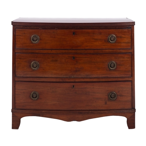 943 - A Regency mahogany bowfront chest of drawers, early 19th century; the top with reeded edges, above t... 