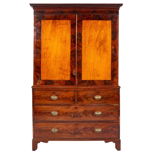 948 - A Regency mahogany linen press, early 19th century; with moulded cornice above twin panel doors open... 