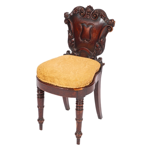 959 - A William IV carved mahogany and later upholstered hall chair, basically circa 1835; the shield back... 