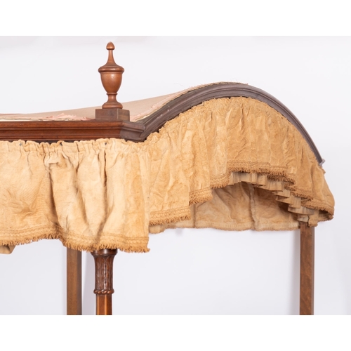 962 - A Victorian mahogany four post single bed, mid 19th century; the arched fabric canopy with moulded c... 