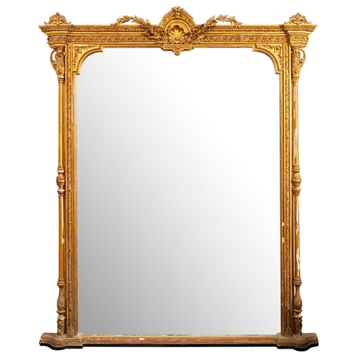 978 - A Victorian giltwood and composition overmantel mirror, circa 1870; with central rocaille and foliat... 